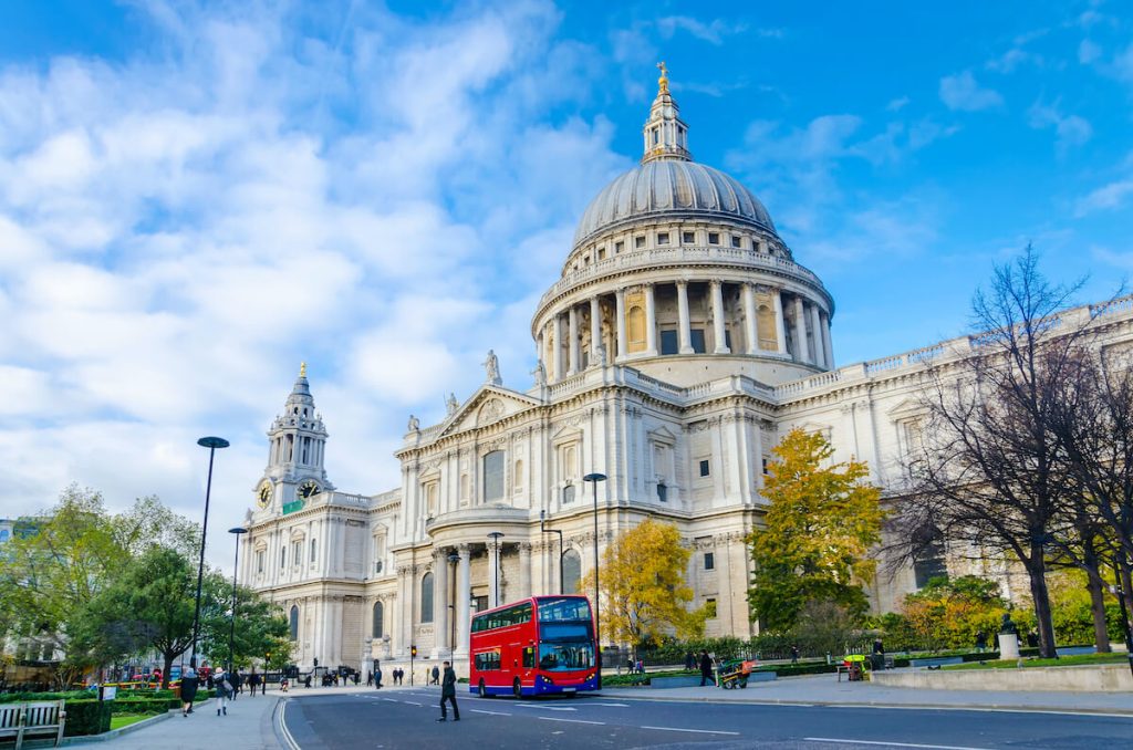 St Paul's Cathedral with red double decker bus driving by